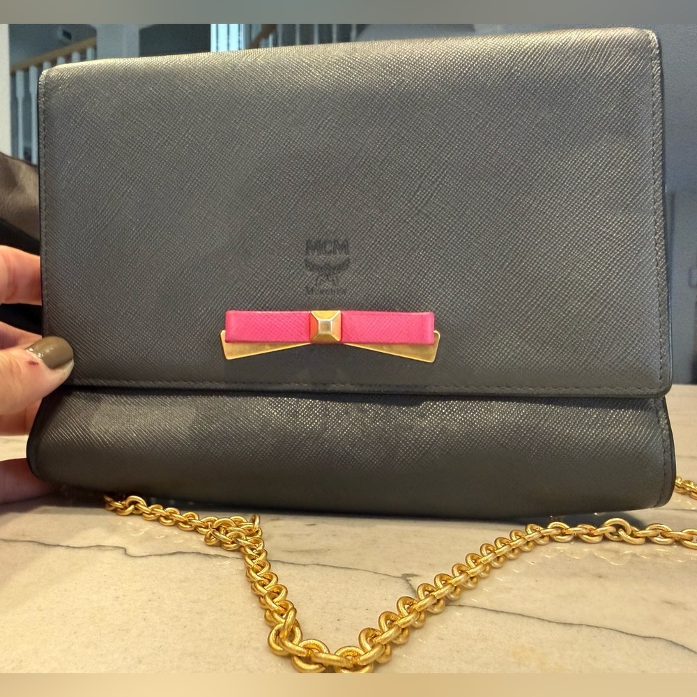 MCM Visetos Mina Crossbody Bag Dark Grey with a Pink Bow Accent